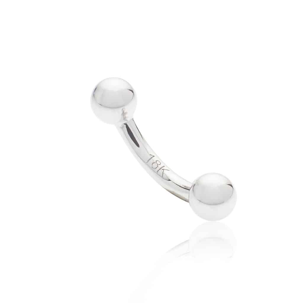 Piercing génital en or blanc barre courbe avec pic et boule en or